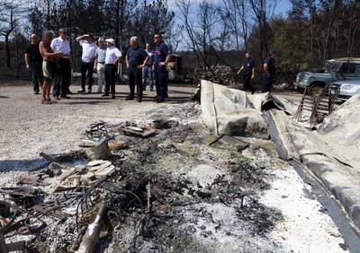 Predsednik republike dr. Danilo Türk si je ogledal požarišča na Črnem Kalu in v občini Hrpelje-Kozina (foto: Tina Kosec/STA)